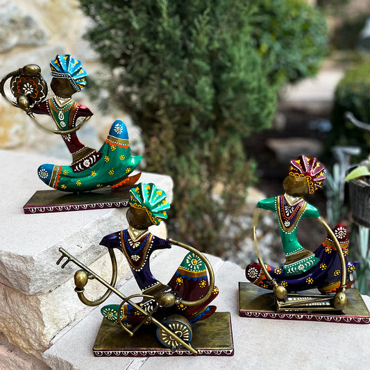 IRON PAINTED MUSICAL SET OF THREE TRADITIONAL DRESSED SARDAR