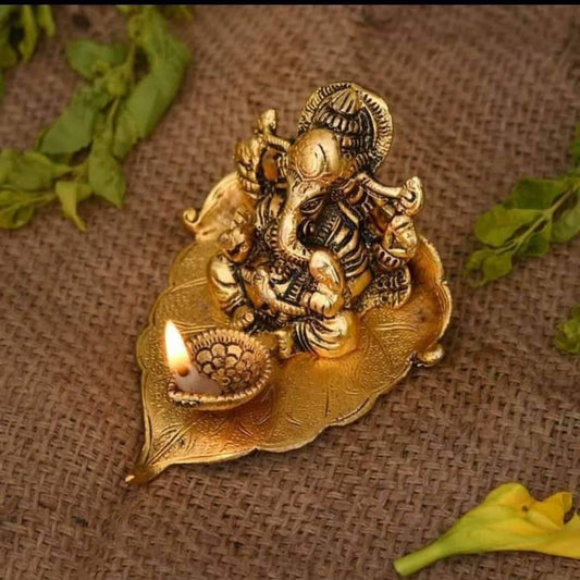 Collectible India Ganesh Idol on Leaf - Lord Ganesha with Diya